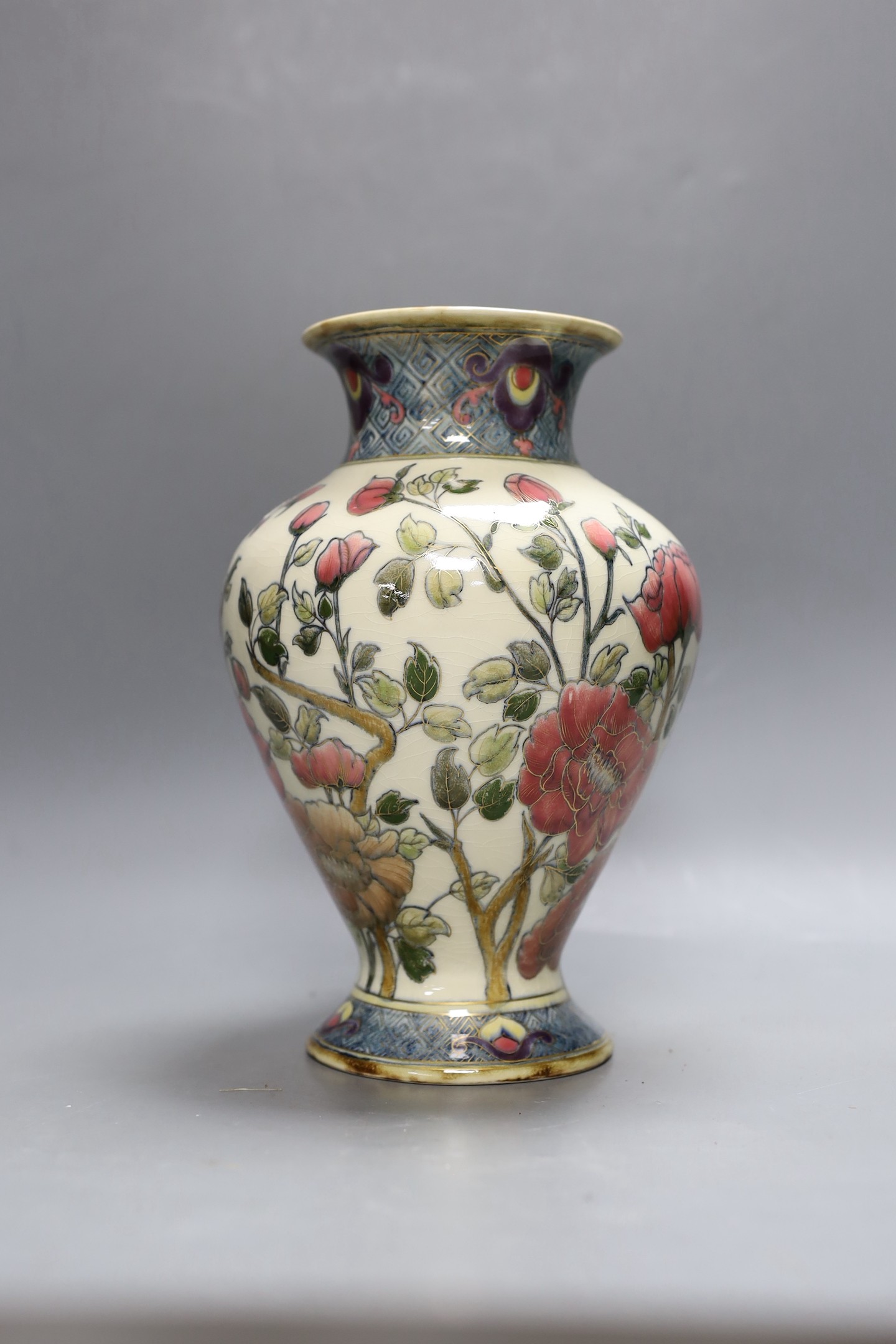An early 20th century Zsolnay Persian style pottery vase. 26cm tall